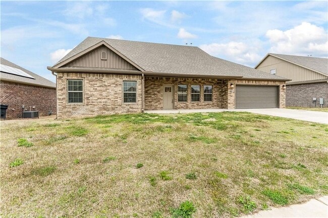 Building Photo - Minutes from I-49! 4BR/2.5BA Home