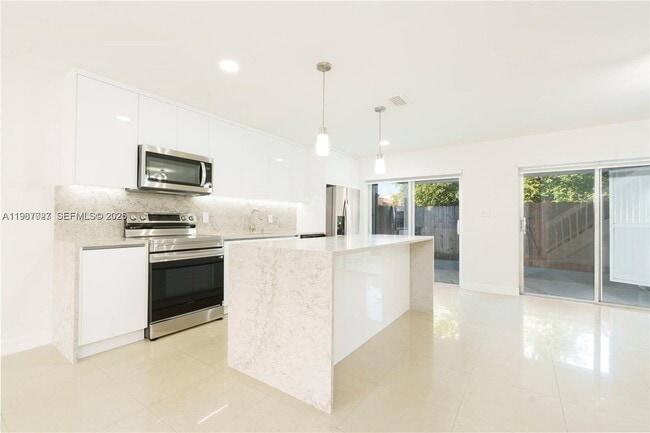 Building Photo - 6080 W 26th Ct Unit 101-9