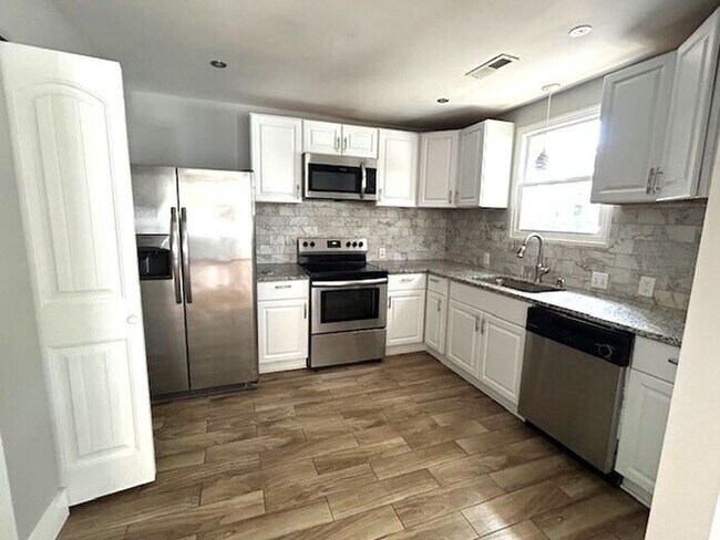 Photo - Brick 3 bedroom, 2 bath ranch style home, Updated kitchen, Open floor plan, Deck