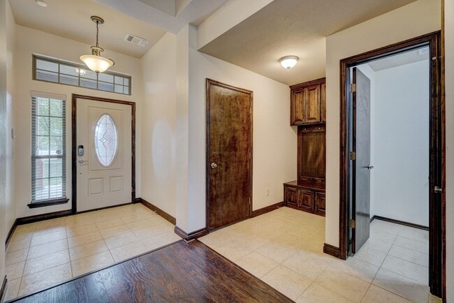 Photo - Stunning 4-Bedroom Home with Fireplace, Island Kitchen, 3-Car Garage & Large Backyard!