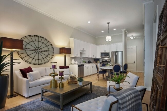 Open living spaces featuring high ceilings & designer kitchens