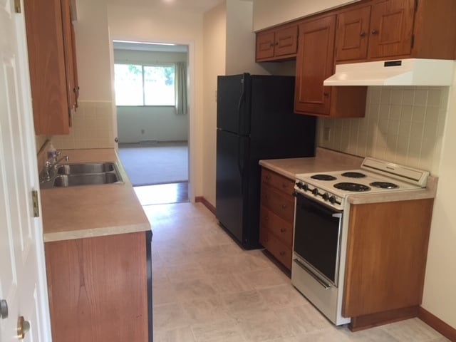 Back door entrance on left to kitchen. - 12601 Blue Ridge Ext Unit 1