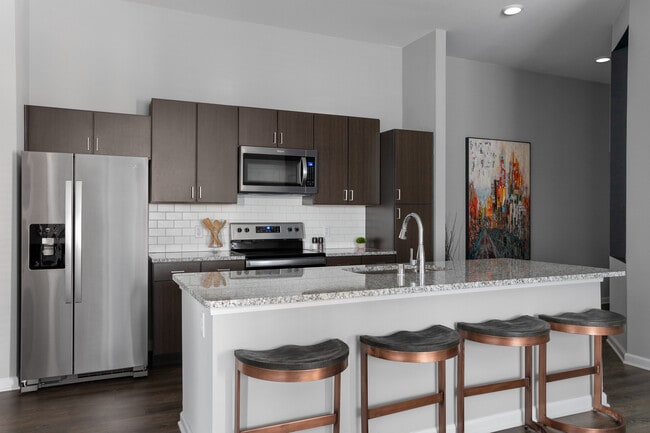 Cook, dine, and gather in a stylish kitchen space. - The Haven