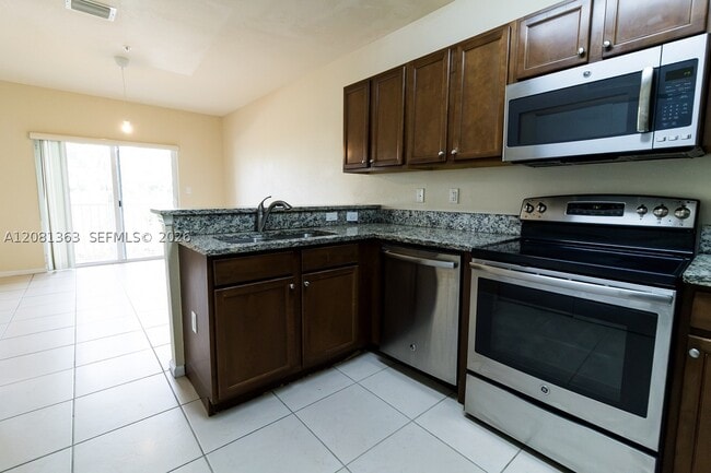 Building Photo - 8800 NW 97th Ave Unit 208