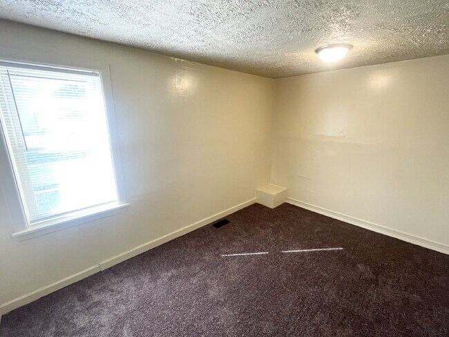 Photo - 4 bedroom HUGE attached, 2-car garage/workshop combo (has electricity