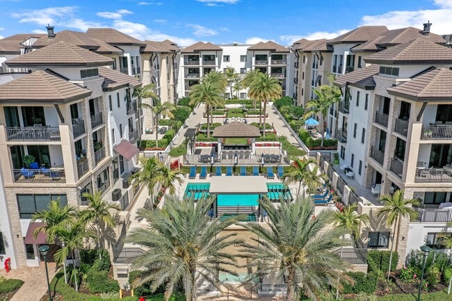 Building Photo - Luxury Living Meets Prime Location! Naples Square 2/2 Condo with Expansive Terrace