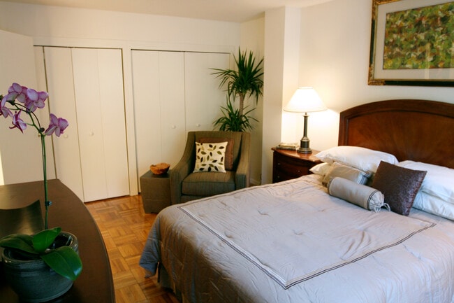 Bedroom with parquet flooring