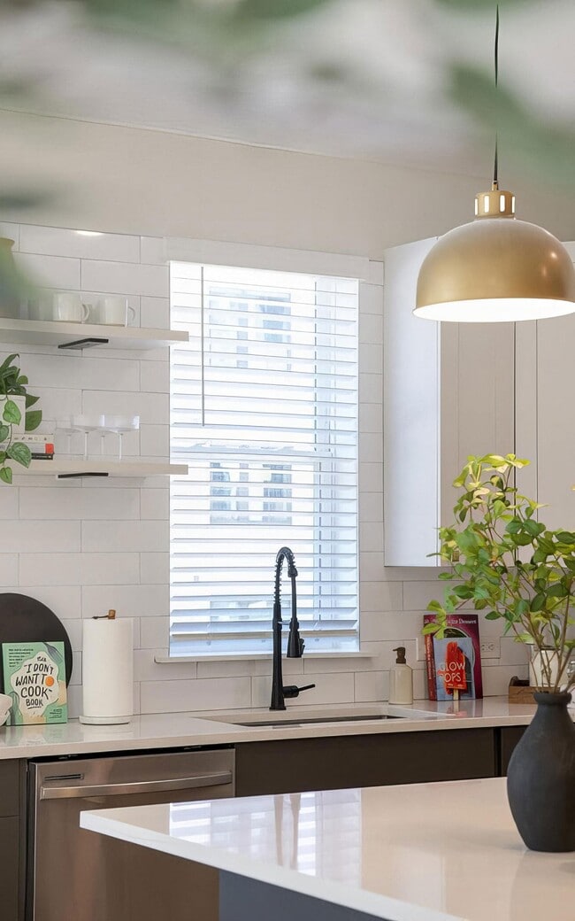 A window over the sink brings daylight into the middle of the kitchen.