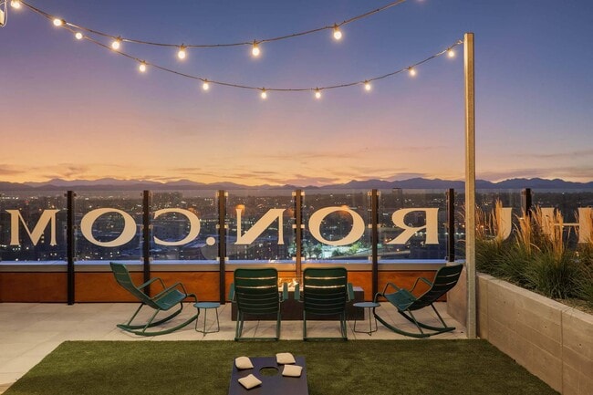 Cozy up on the rooftop with a warm fireplace and ambient lighting, perfect for evening relaxation. - Windsor 3000 Huron