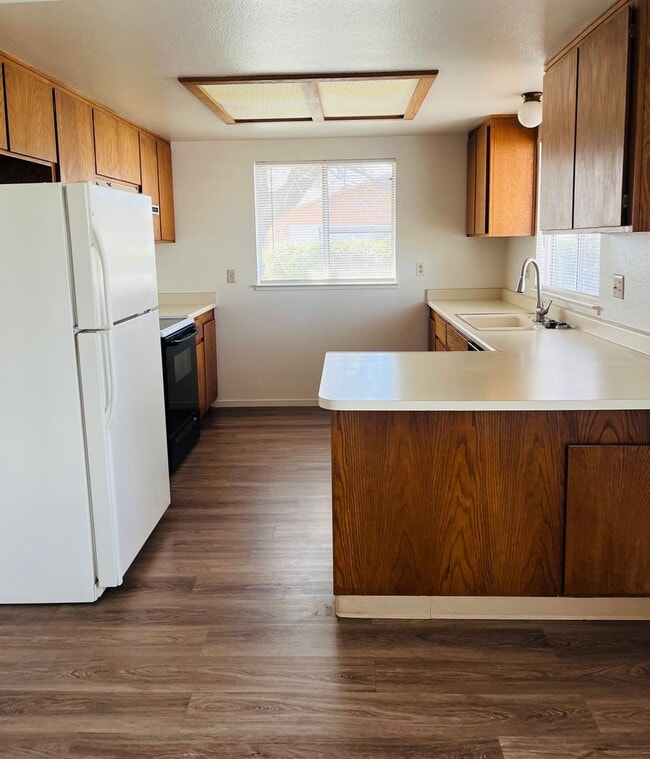 Photo - Spacious 2 Bedroom/2 bath duplex with a 2 car garage and laundry hook ups in a great North Modest...