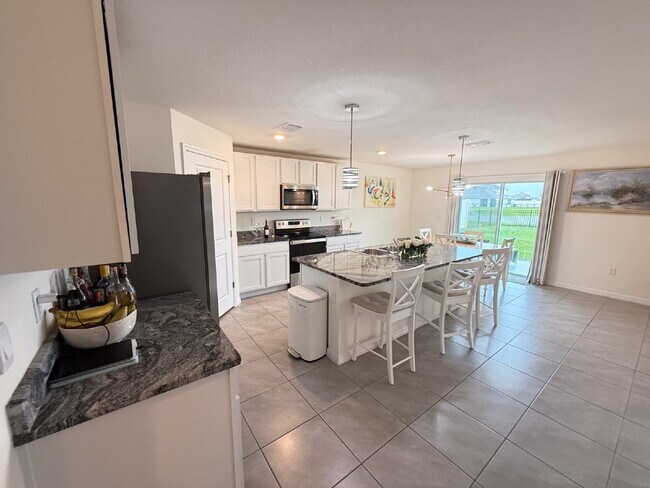 Photo - Spacious 4-Bedroom Home with Granite Count...