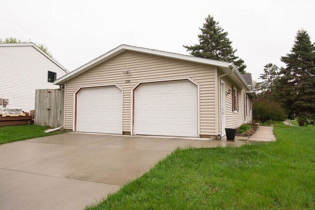 Photo - Ranch-style home with great fenced yard & patio!