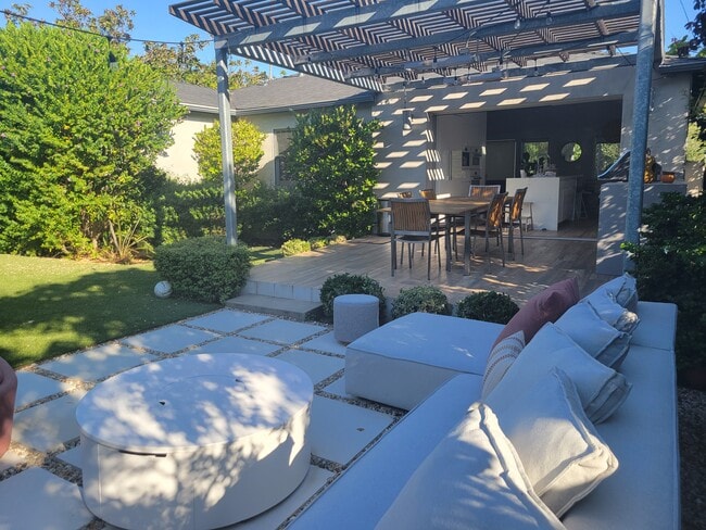 Backyard, dinning area and outdoor grill open to the kitchen