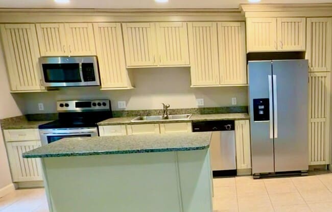 Building Photo - Top-Floor South End Villa Near Coligny Beach- Available Now!