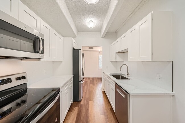 Photo - Completely Updated 2 Bedroom 2 Bathroom Condo Available NOW! Garage Parking Included! Unit 202