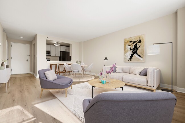 Elegant open living room with modern furniture, bright natural light, and stylish dining area adjacent to a sleek kitchen with stainless steel appliances, quartz countertop, and gas stove