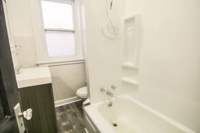 Photo - This 2 bedroom 1 bath home has been completely refinished with brilliant hardwood floors throughout!