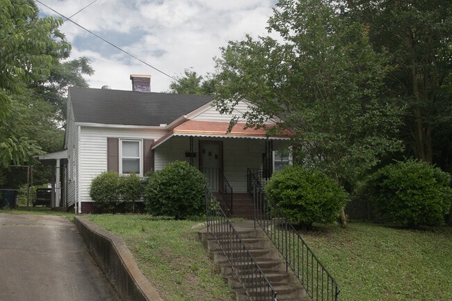 Building Photo - Four-Bedroom Bungalow with Fenced Yard Nea...