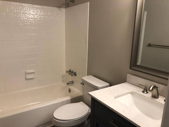 Photo - Charming 2BR Condo with Granite Countertops, Pool Access & Included Lawn Care