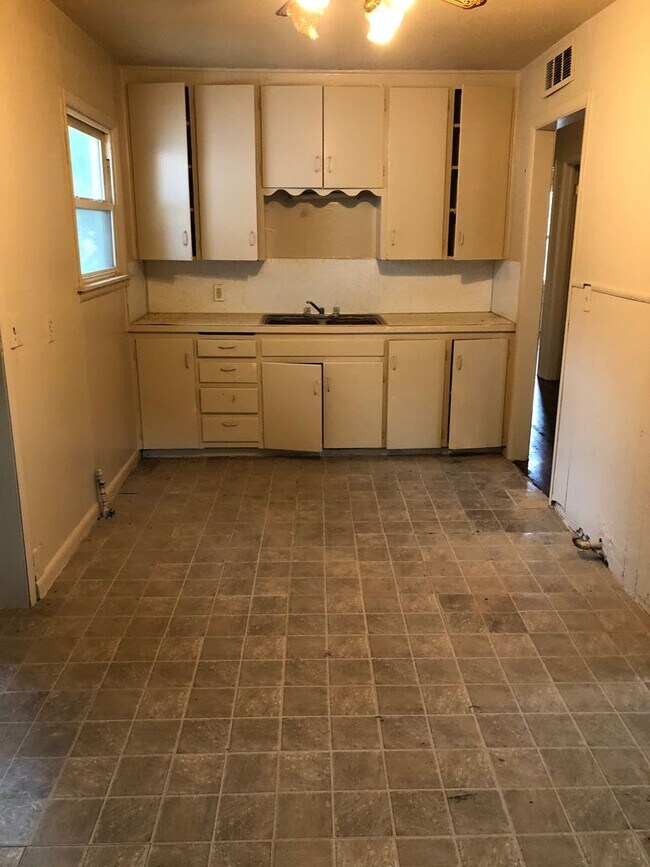 Photo - Three bedroom plus den, could be fourth bedroom