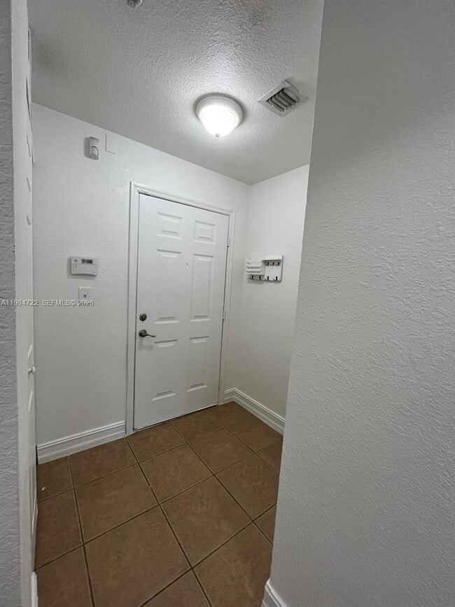Building Photo - 7995 NW 8th St Unit 115
