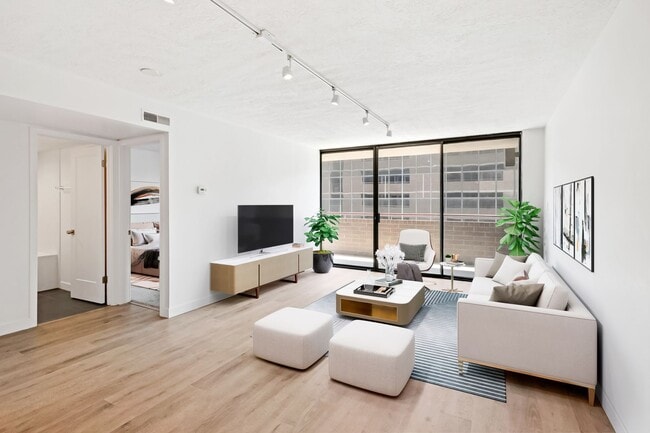 Building Photo - 2BR Condo w/ Covered Parking and Balcony Views at Broadway Towers