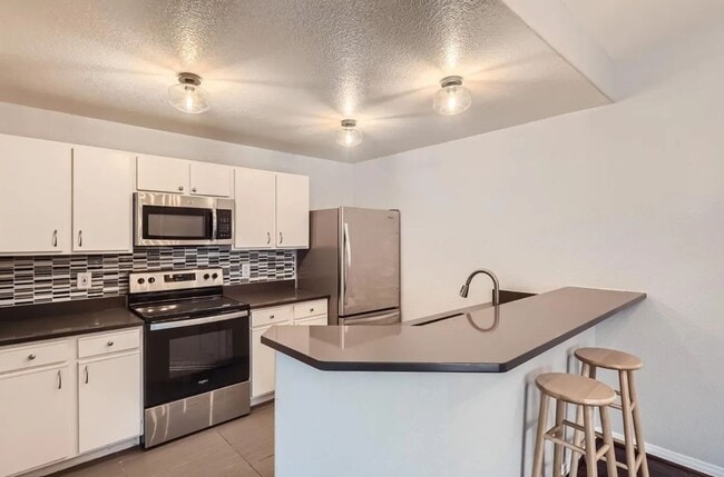 Photo - Updated 2 bedroom, 2 bath condo - Available now! Unit E