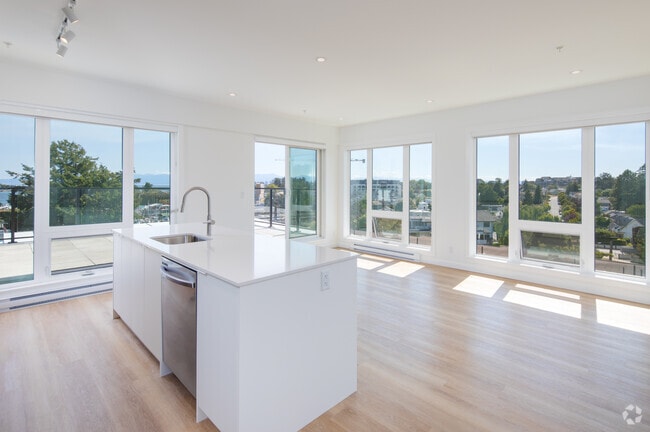 2BR, 2BA - 893SF - Kitchen and Living Room