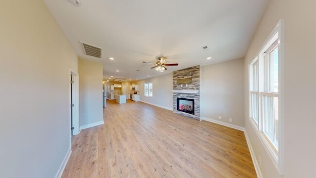 Photo - Stylish Home with Feature Stone Front Fireplace, Open Layout and Premium Upgrades