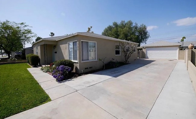 Front Door + Porch + Driveway + Garage - 327 E Collins Ave