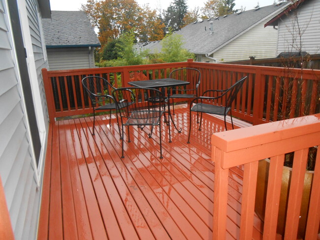 Photo shows old deck. Brand-new, newly built deck is much larger! Perfect for outdoor relaxing - 4215 147th St SW