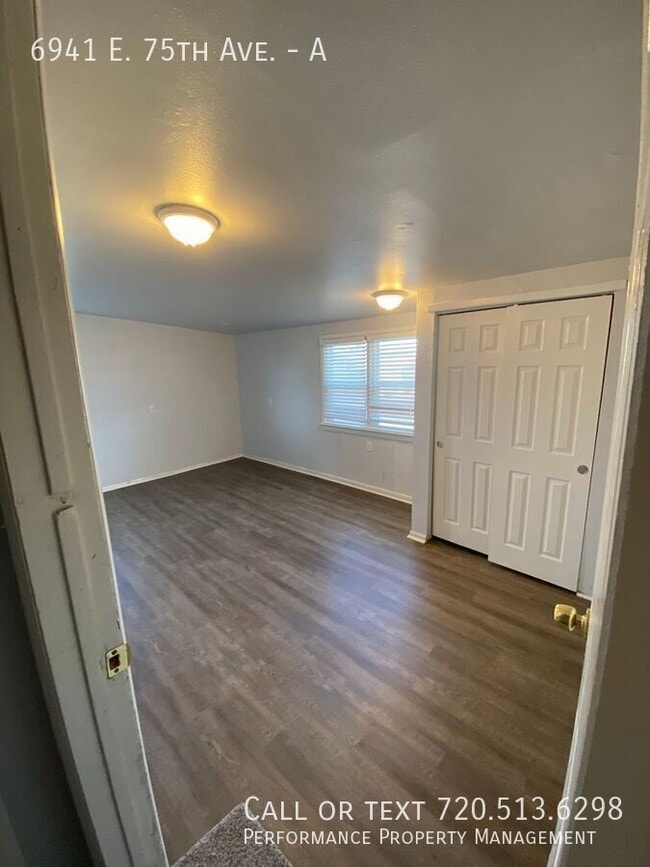 Building Photo - 6941 E 75th Ave Unit A