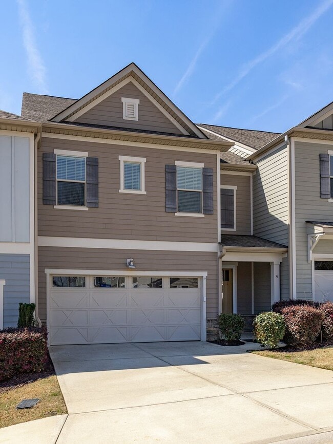 Photo - **MOVE IN SPECIAL! 50% off first month's rent!!** Spacious 4BR Townhouse with 2-Car Garage Near D...