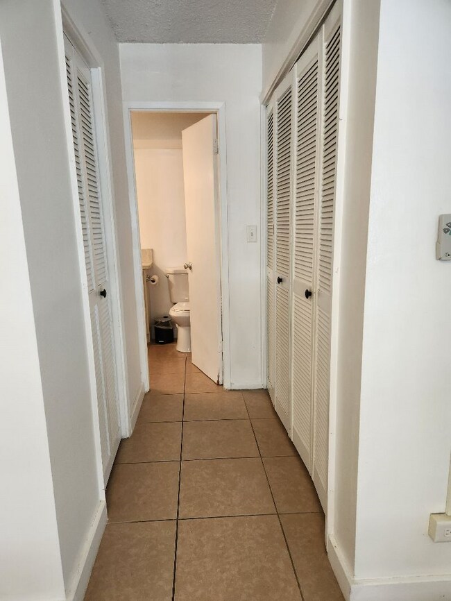 hallway from bedroom to bath - 411 Kaiolu St Unit 411