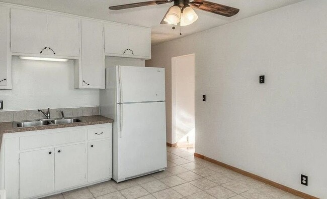 Photo - Bright & Spacious 3-Bedroom Duplex Unit on Large Corner Lot with Wood Floors & Garage!