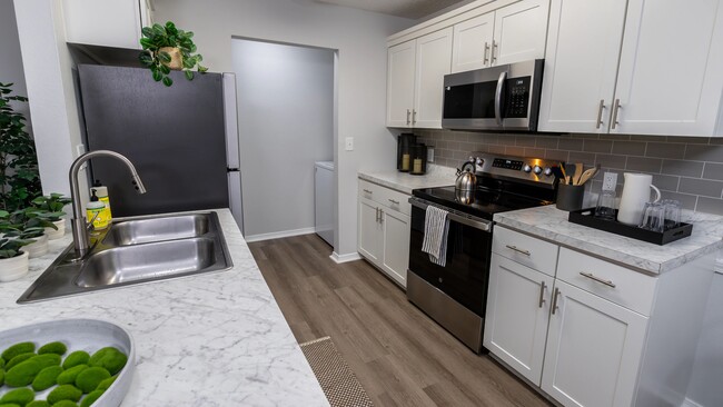 Stylish kitchens offering a modern look with stainless steel appliances, marble countertops, and a functional layout.
