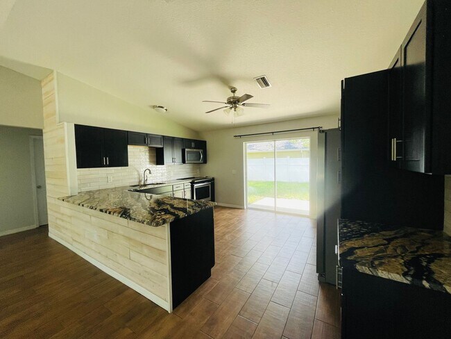 Photo - *UPDATED NORTH PORT 3/2/2 HOME*