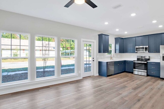 Photo - **Available now. This pet-friendly property features a small fenced yard with water and lawn main...