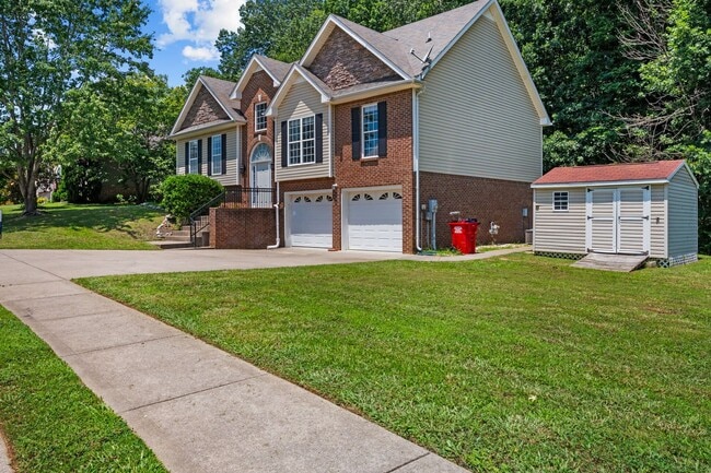 Photo - Stunning Stone Fireplace • Finished Basement • Fenced Yard