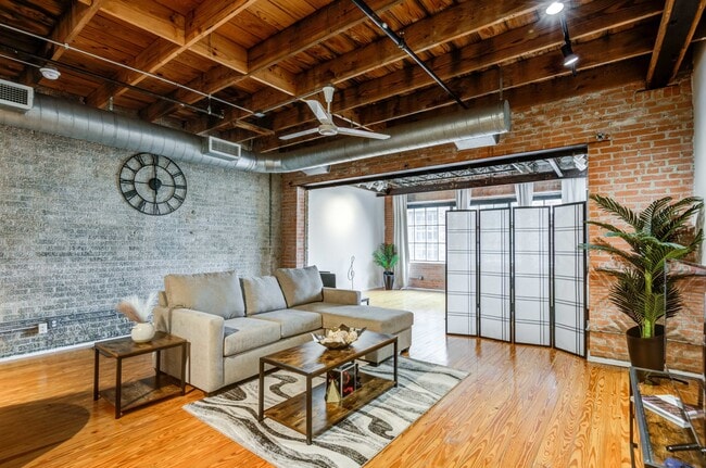 Renovated Lofts with exposed steel beams and brick accents