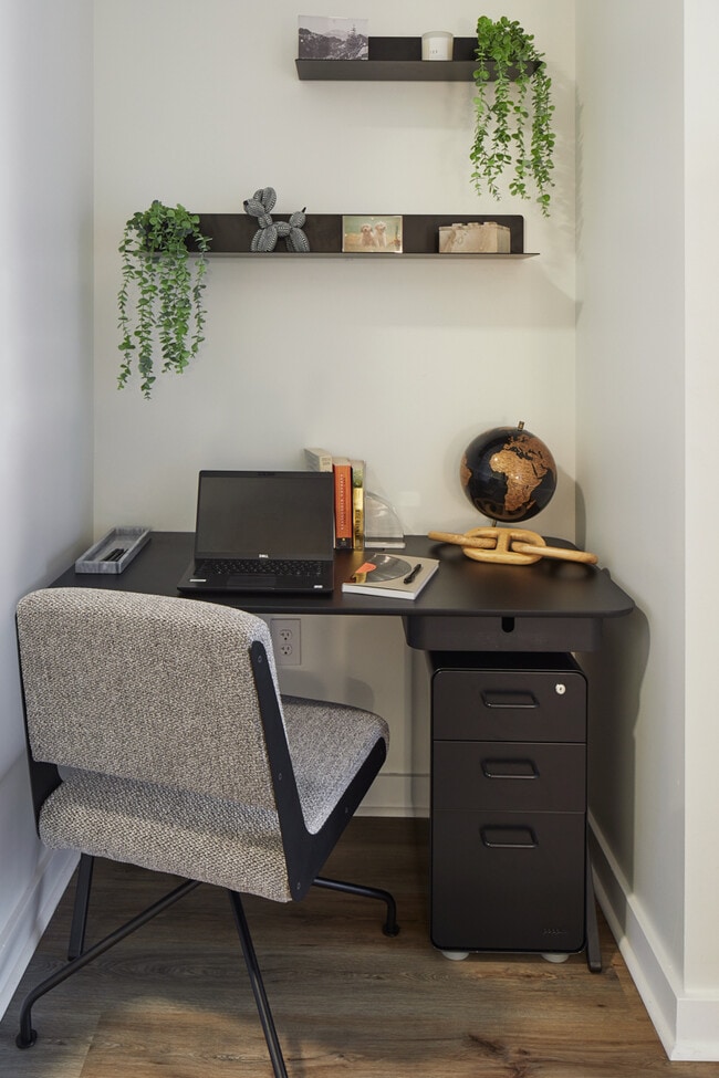 Desk with wood-style flooring. - Griffis Seattle Waterfront