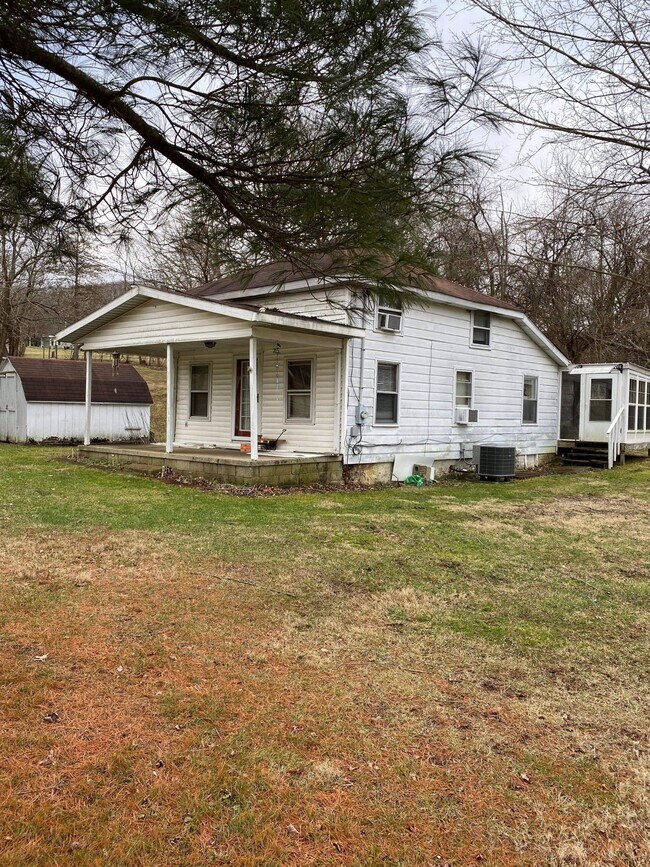 Front view. Before new roof. - 152 Madden Rd