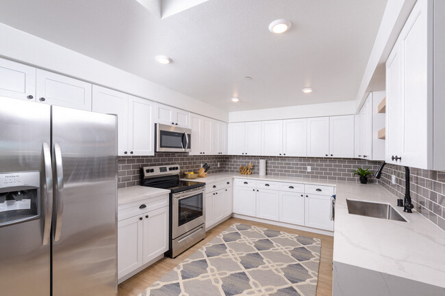 Upgraded stainless steel appliance package - Newhall Crossings Apartments