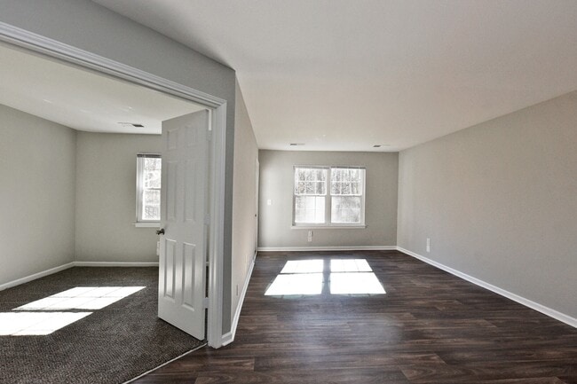 Spacious living room with hardwood-style flooring