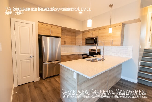 Photo - Amazing 2 bedroom, 2 bathroom suite with zero scaped yard! ??Showings available NOW at (306) 774-... Unit Upper Level