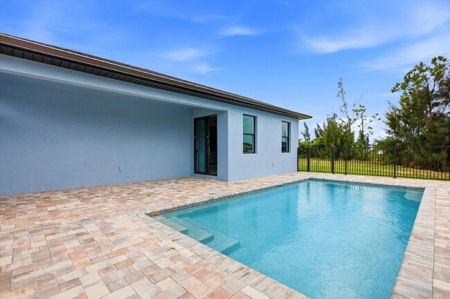 Building Photo - Brand New Canal-Front Pool Home for Rent, 3/2/2, NE Cape Coral. The Builder Didn't Cut Corners, S...