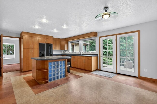 Photo - Spacious 4 Bedroom Home with Large Kitchen, Bonus Sunlit Room, and Deck