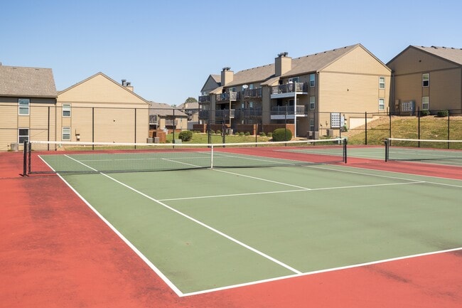 Serve, rally, and play—enjoy a game on the tennis court at Cedar Crest Apartments.