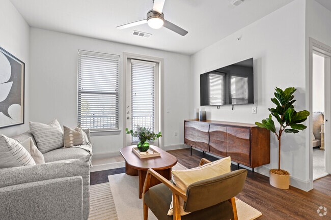 1BR, 1BA - 707SF (A1) - Living Room & Patio - Park Hill