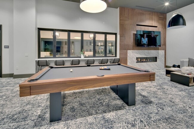 Game room with pool table at Enclave Heritage Flats in Otay Ranch